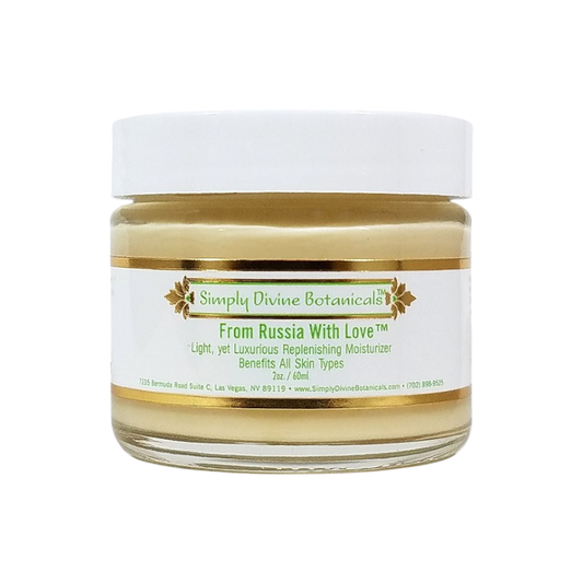 A 2 oz (60 ml) jar of Simply Divine Botanicals From Russia With Love Protective Regenerating Moisturizer with a white lid and gold label, made with vegan ingredients for all skin types.
