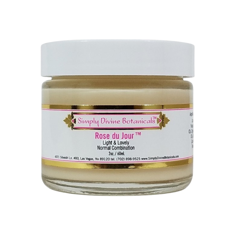 A 2 oz (60 ml) jar of Simply Divine Botanicals Rose du Jour Light Soothing Moisturizer, designed for normal or blemish-prone skin, features a white lid and pink-gold label.