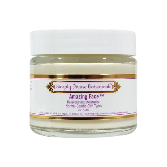 A clear jar with a white lid labeled "Simply Divine Botanicals Amazing Face Rejuvenating Nourishing Moisturizer," featuring a cream enriched with natural ingredients for deep hydration.