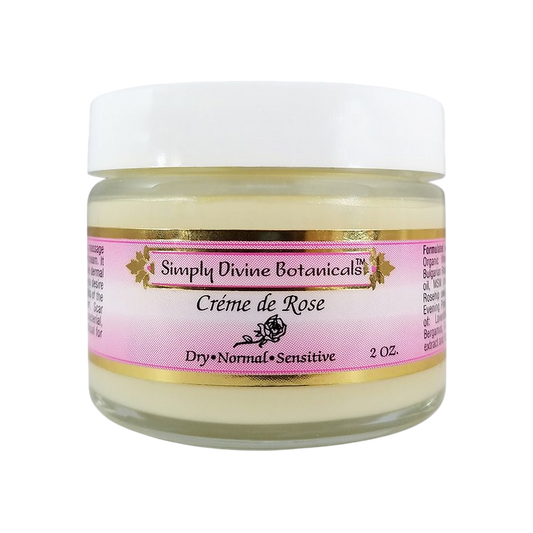 A 2oz glass jar of Simply Divine Botanicals Creme de Rose Radiant Hydrating Moisturizer for dry, normal, and sensitive skin, featuring a white lid and pink label.