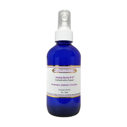 Simply Divine Botanicals' Keeping Abreast Of It Deodorant to Encourage Lymphatic Circulation comes in a blue spray bottle with a white label accented in gold and purple, and features essential oils for natural freshness.