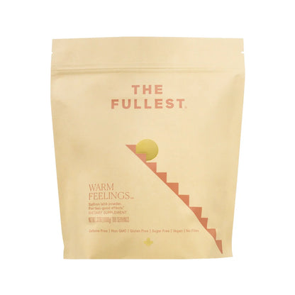 The packaging of THE FULLEST's Warm Feelings 100-Day Supply saffron latte powder is designed in beige with a minimalist staircase leading to a sun icon. This product aims to enhance mood and support restorative sleep, while being dietary, caffeine-free, non-GMO, gluten-free, sugar-free, vegan, and free from fillers.