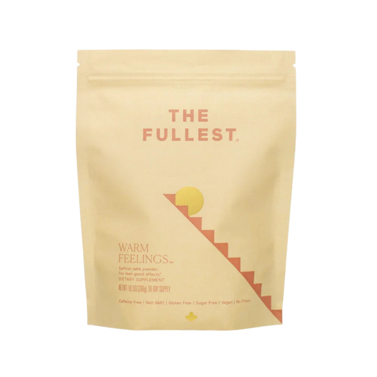 THE FULLEST’s Warm Feelings 30-Day Supply comes in a beige resealable pouch. The minimalist sun and staircase design reflect its mood-supporting, caffeine-free saffron formula—perfect for a calming daily latte ritual.