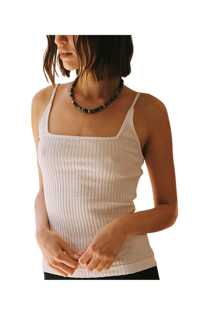 White 
A woman with chin-length brown hair wears the LA Relaxed Pointelle Square Cami and a beaded necklace, standing against a plain background with her hands loosely clasped in front of her.